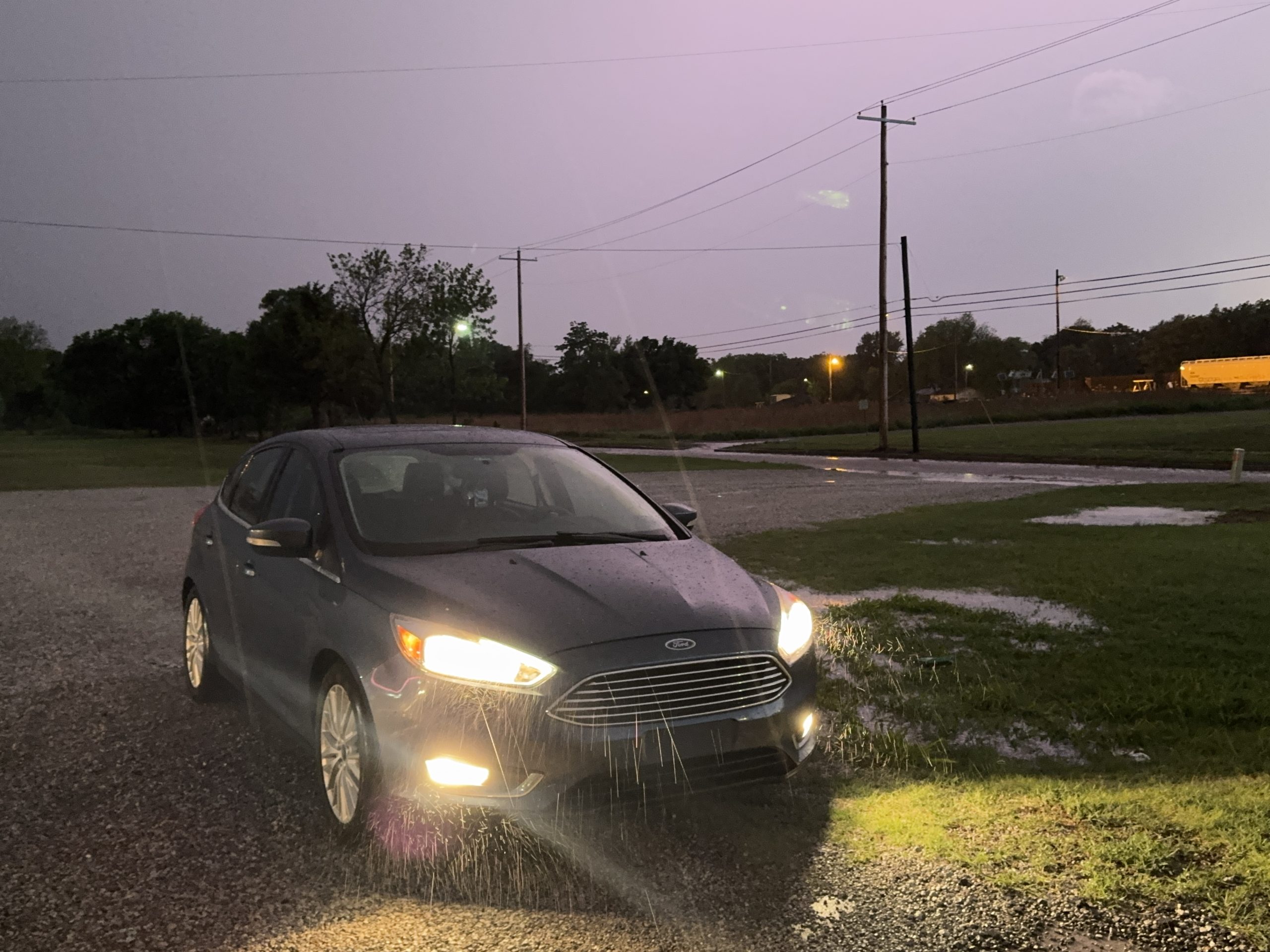 Car in storm at night